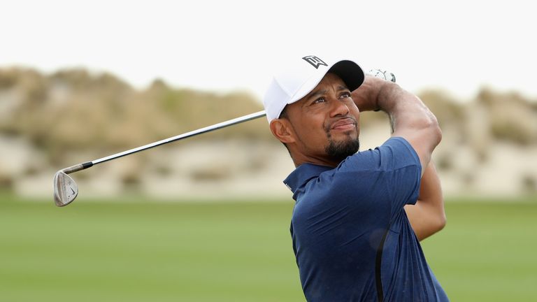 Tiger Woods made seven birdies and kept a bogey off his card in a 65