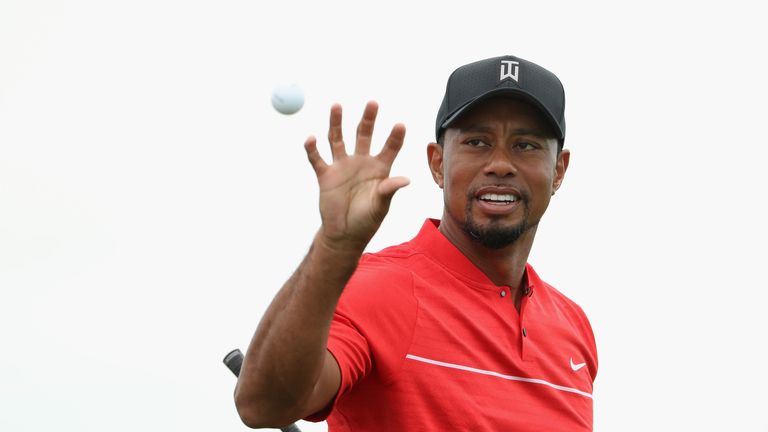 NASSAU, BAHAMAS - DECEMBER 04:  Tiger Woods of the United States catches a golf ball on the practice range during the final round of the Hero World Challen