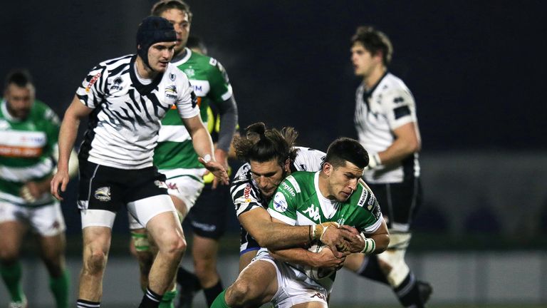 Treviso's Tommaso Allan tackled by Giovanbattista Venditti of Zebre