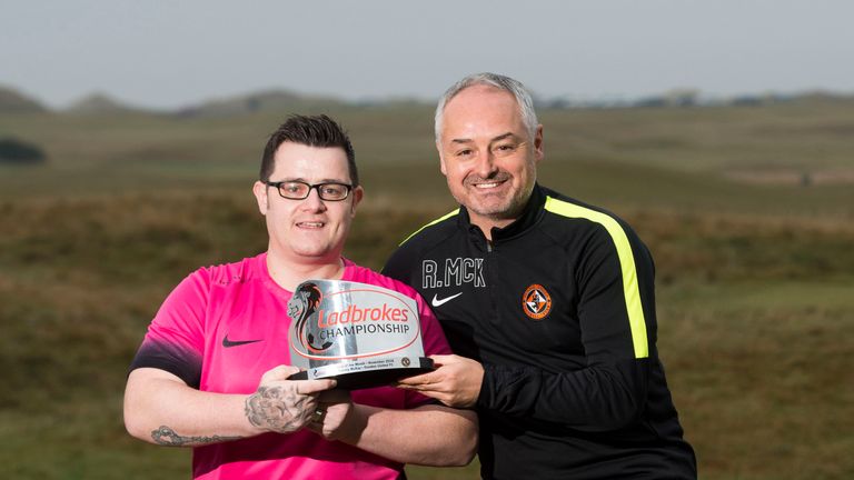 Dundee Utd fan Tommy McKay receives goal of the mo nth award for Terrors boss Ray McKinnon