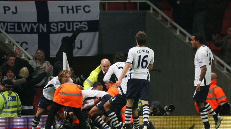 Tottenham players celebrate after clinching a 4-4 draw with Arsenal