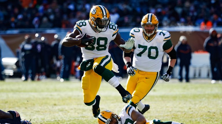 CHICAGO, IL - DECEMBER 18:  Ty Montgomery #88 of the Green Bay Packers jumps over teammate  Richard Rodgers #82 in the second quarter against the Chicago B
