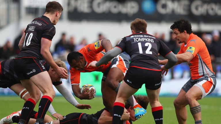 Vereniki Goneva of Newcastle Falcons looks for a way through the Saracens defence 