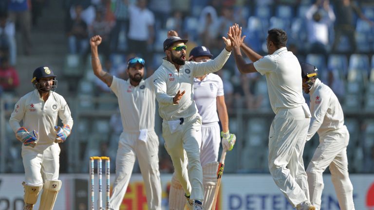 India's captain Virat Kohli (C) celebrates with teammates after the dismissal of England's Jonny Bairstow on the final day of the fourth Test cricket match