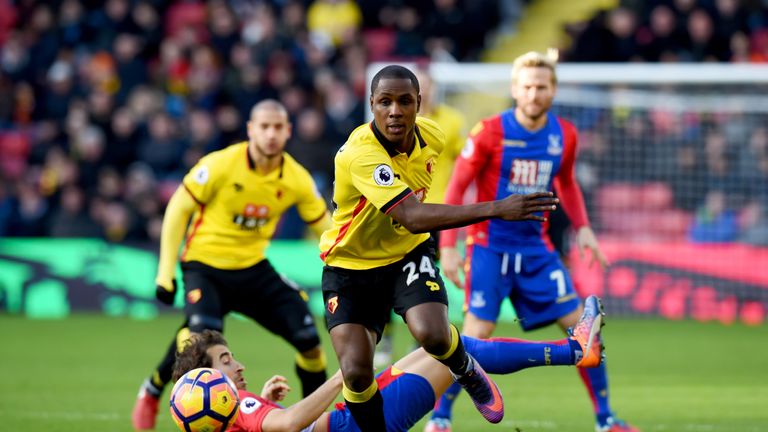 WATFORD, ENGLAND - DECEMBER 26:  Odion Ighalo of Watford evades a challenge from Mathieu Flamini of Crystal Palace during the Premier League match between 