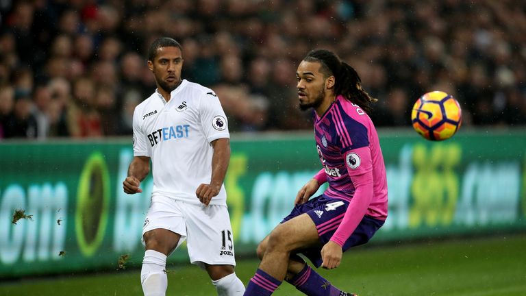 Swansea City's Wayne Routledge (left) and Sunderland's Jason Denayer (right) battle for the ball during the Premier League match at the Liberty Stadium
