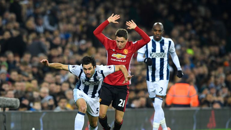 Claudio Yacob of West Brom Albion (L) is fouled by Man United's Ander Herrera