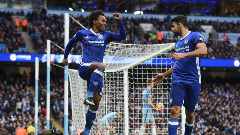 Chelsea's Brazilian midfielder Willian (C) celebrates scoring his team's second goal with Chelsea's Brazilian-born Spanish striker Diego Costa during the E