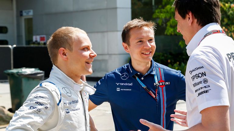 Wolff with Bottas and his trainer, Antti Vierula, at last year's Malaysia GP 