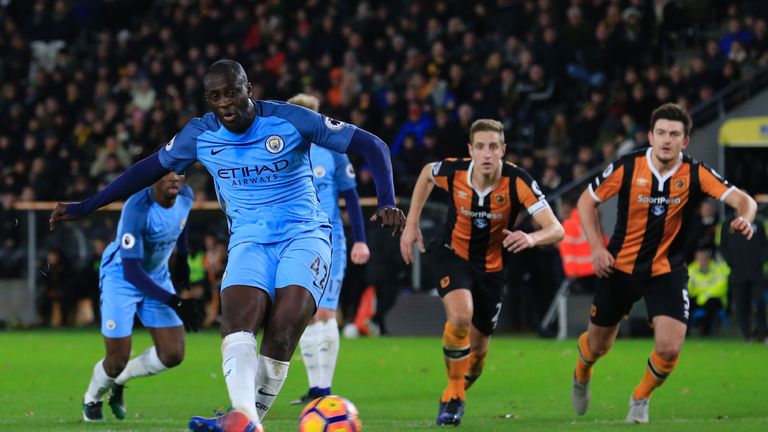 Yaya Toure puts Manchester City ahead against Hull from the penalty spot