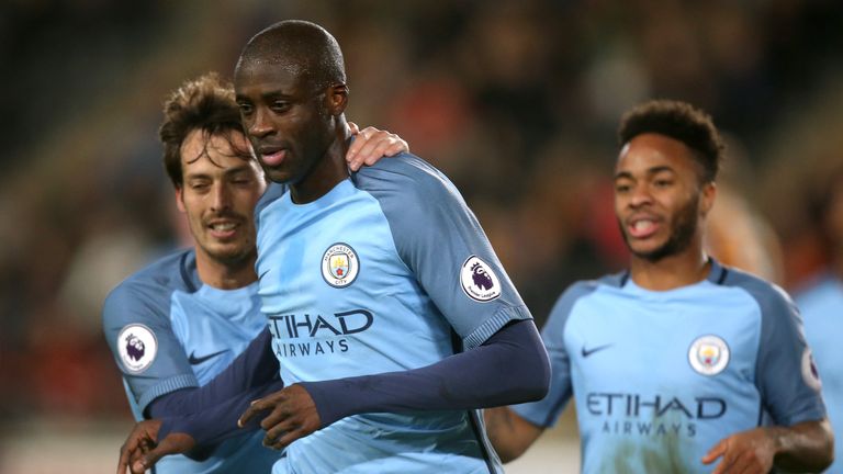 Yaya Toure (C) celebrates giving Manchester City the lead