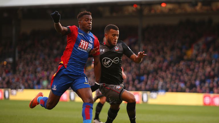 LONDON, ENGLAND - DECEMBER 03:  Ryan Bertrand of Southampton and Wilfried Zaha of Crystal Palace compete for the ball during the Premier League match betwe