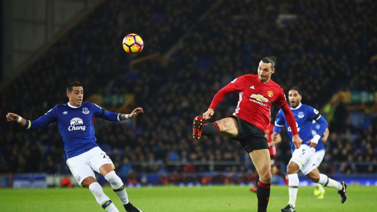 LIVERPOOL, ENGLAND - DECEMBER 04:  Zlatan Ibrahimovic of Manchester United scores their first goal as Ramiro Funes Mori of Everton looks on during the Prem