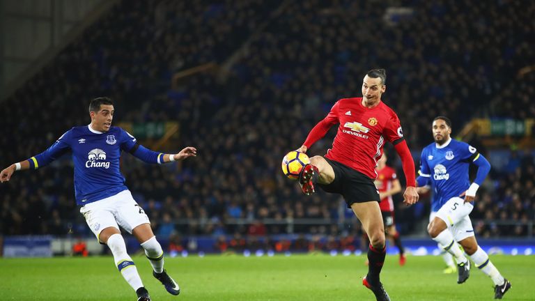 Zlatan Ibrahimovic lobs the ball over an onlooking Ramiro Funes Mori