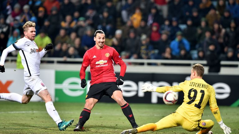 Manchester United's Swedish forward Zlatan Ibrahimovic (C) kicks to score a goal against Zorya Luhansk's Ukrainian goalkeeper Igor Levchenko during the UEF