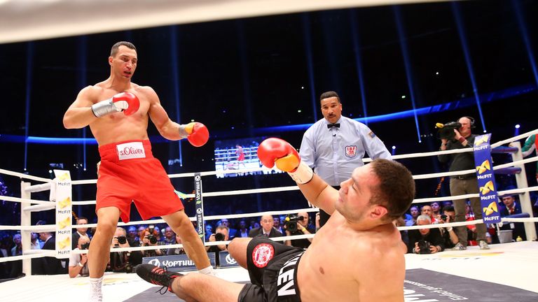 Wladimir Klitschko (R) of Ukraine exchanges punches with Kubrat Pulev (L)