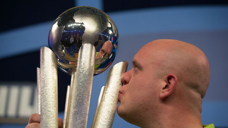 Michael van Gerwen kisses the Sid Waddell trophy