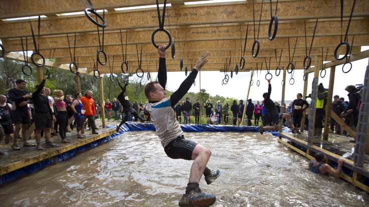 A participant traverses the hoops during the Tough Mudder endurance race in Henley on Thames, West of London, on April 26, 2014. The course is set out over