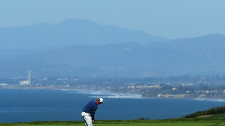 Defending champion Brandt Snedeker putts on the fourth green, during Friday's second round at Torrey Pines