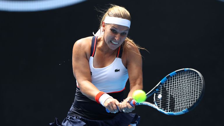 Dominika Cibulkova of Slovakia plays a backhand in her first round match against Czech player Denisa Allertova