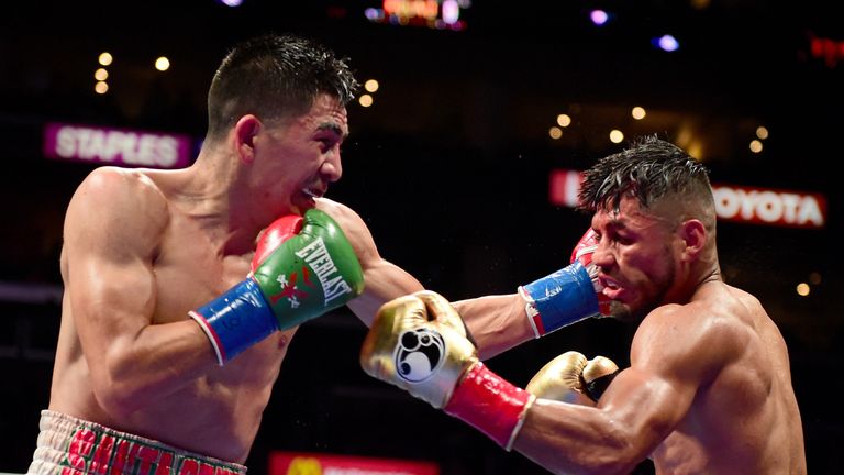 LOS ANGELES, CA - AUGUST 29:  Leo Santa Cruz punches Abner Mares of Mexico during the ninth round of the WBC diamond featherweight and WBA featherweight ch
