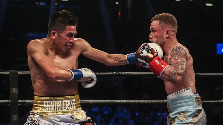 NEW YORK, NY - JULY 30:  Leo Santa Cruz of Mexico (gold trunks) fights Carl Frampton of Northern Ireland (blue trunks) during their  12 round WBA Super  fe