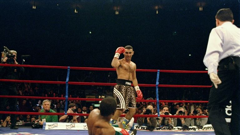 18 Dec 1997:  Prince Naseem Hamed stands over Kevin Kelley during a fight at Madison Square Garden in New York City, New York.  Hamed won the fight with a 