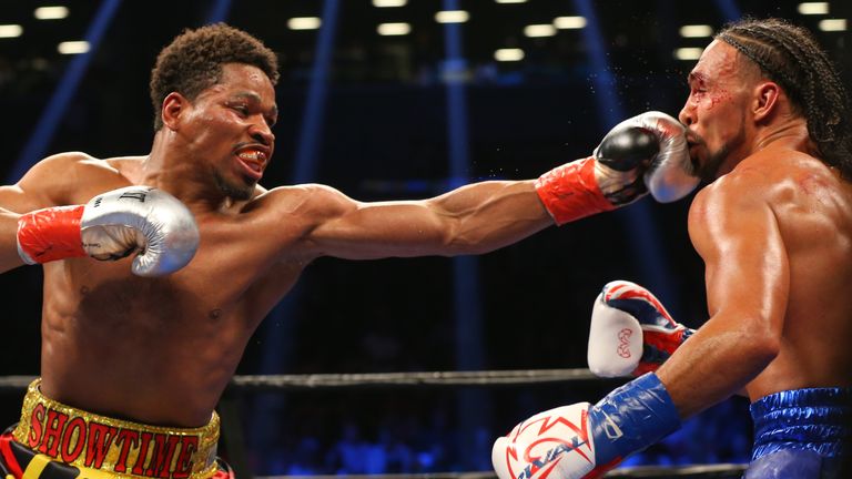 BROOKLYN, NY - JUNE 25: Keith Thurman (right) takes a left hand from Shawn Porter (left) during their 12 round WBA welterweight championship bout at the Ba