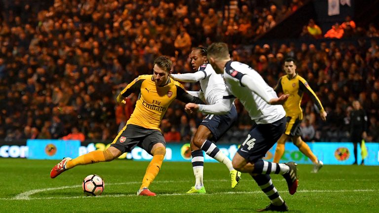 Aaron Ramsey (L) equalises for Arsenal