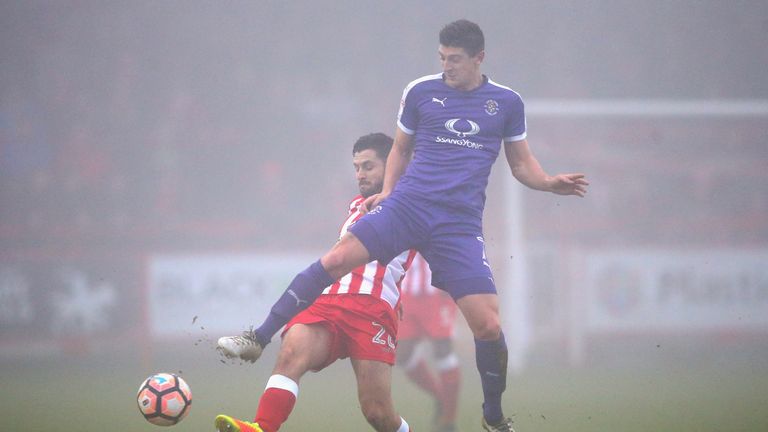 Seamus Conneely of Accrington Stanley is tackled by Luton's Jake Gray 