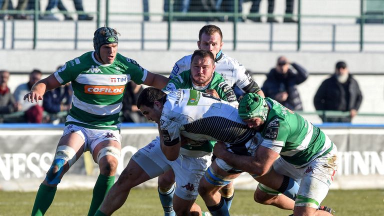 Adam Ashe is tackled by Dean Budd of Treviso