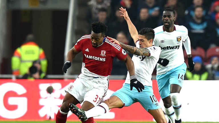 MIDDLESBROUGH, ENGLAND - JANUARY 21: Adama Traore of Middlesbrough (L) is tackled by Manuel Lanzini of West Ham United (R) during the Premier League match 
