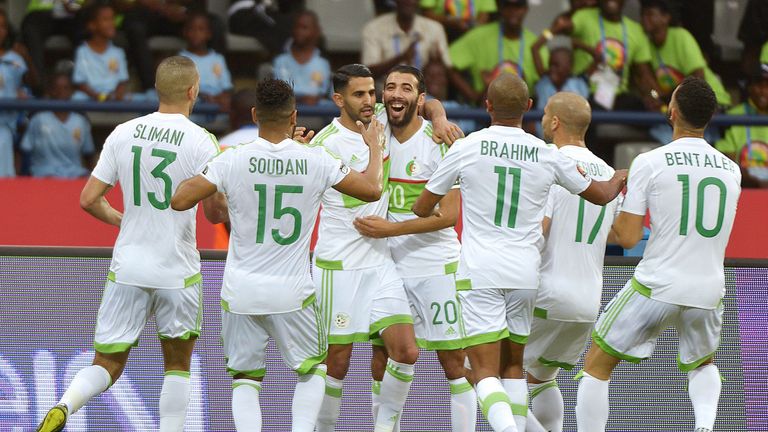 Riyad Mahrez celebrates after scoring against Zimbabwe