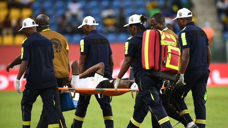 Ghana's defender Baba Rahman is carried off the pitch against Uganda