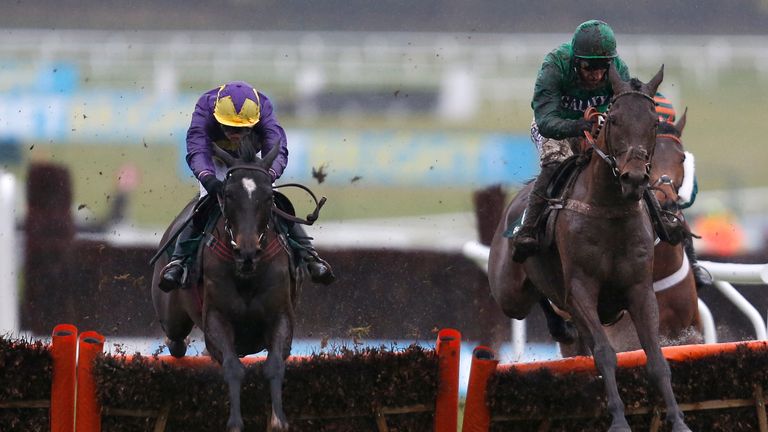 Lizzie Kelly riding Agrapart (L) clear the last to win the Dornan Engineering Relkeel Hurdle from L'Ami Serge