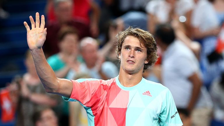 Alexander Zverev celebrates winning the men's singles match against Roger Federer