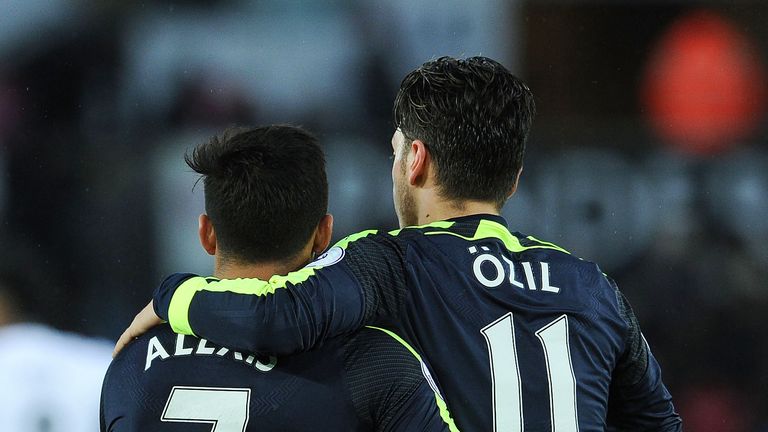 Alexis Sanchez with Mesut Ozil during the Premier League match between Swansea City and Arsenal at Liberty Stadium
