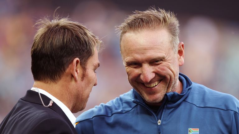 Former cricketers Shane Warne and Allan Donald speak to each other before game one of the International Twenty20 Series 