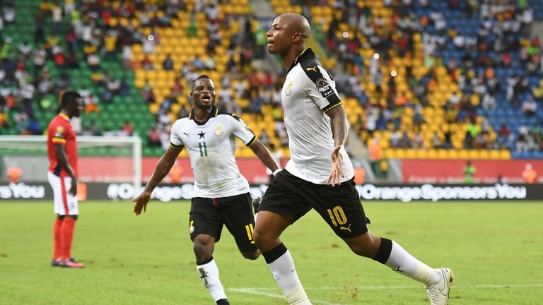 Ghana's forward Andre Ayew celebrates with Mubarak Wakaso after scoring against Uganda