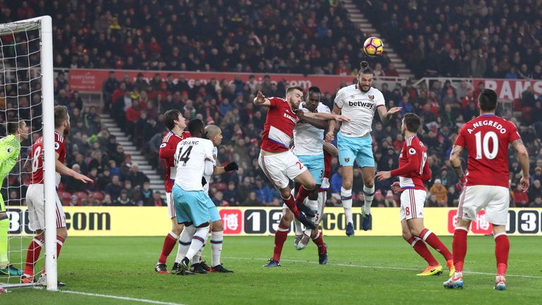 MIDDLESBROUGH, ENGLAND - JANUARY 21:  Andy Carroll of West Ham United (R) scores his sides first goal with a header during the Premier League match between