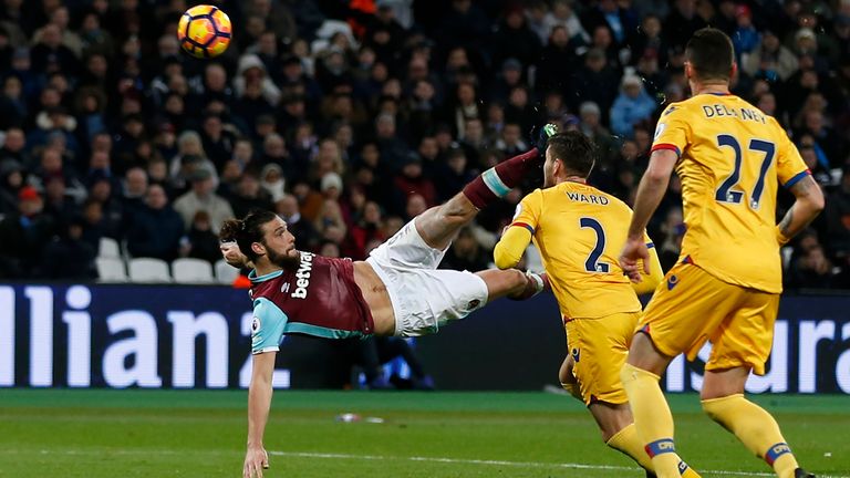 West Ham United's English striker Andy Carroll shoots to score their second goal with this bicycle kick during the English Premier League football match be