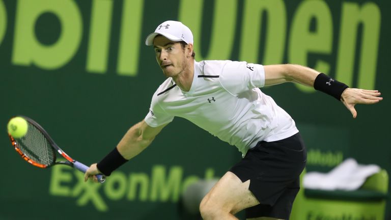Britain's Andy Murray returns the ball to Serbia's Novak Djokovic during their final tennis match at the ATP Qatar Open in Doha on January 7, 2017. / AFP /