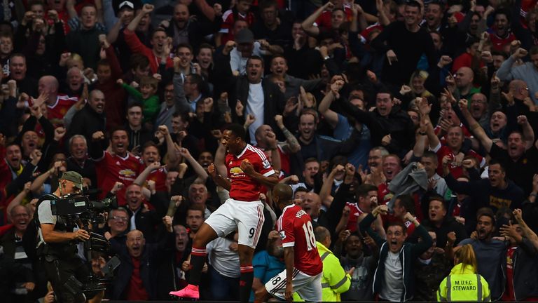 MANCHESTER, ENGLAND - SEPTEMBER 12:  Anthony Martial of Manchester United celebrates scoring his team's third goal with Ashley Young during the Barclays Pr