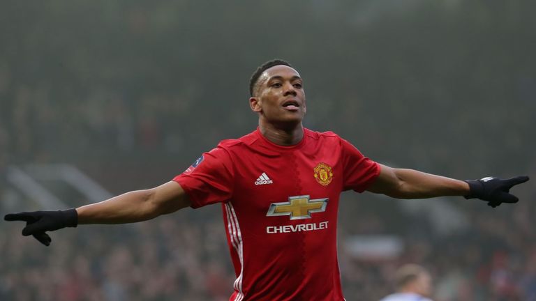 Anthony Martial wheels away in celebration after scoring in Manchester United's FA Cup third-round tie with Reading at Old Trafford