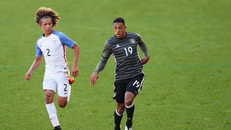 LEIGH, GREATER MANCHESTER - OCTOBER 05:  Anton Donkor of Germany goes past Marlon Fossey of USA during the Under 20s Four Nations Tournament match between 