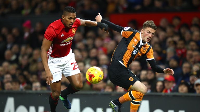 Antonio Valencia of Manchester United holds off  Markus Henriksen of Hull City during the EFL Cup semi-final first leg