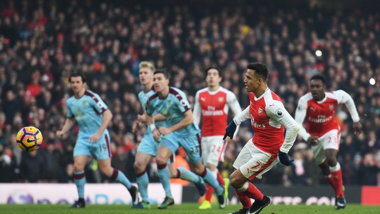 LONDON, ENGLAND - JANUARY 22:  Alexis Sanchez of Arsenal converts the penalty to score his team's second goal during the Premier League match between Arsen