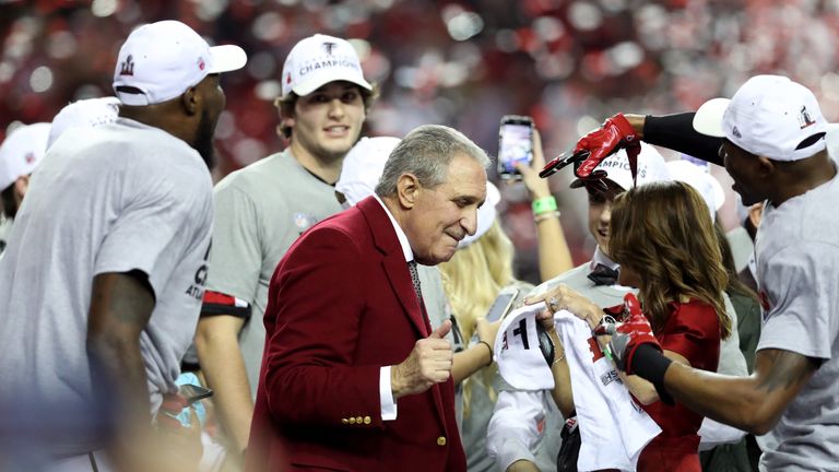 ATLANTA, GA - JANUARY 22: Atlanta Falcons owner Arthur Blank celebrates with his team after defeating the Green Bay Packers in the NFC Championship Game at