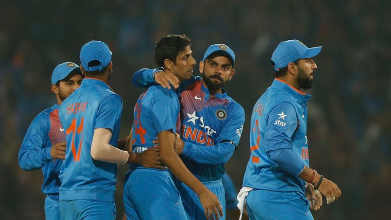 India's Ashish Nehra and captain Virat Kohli celebrate the wicket of England's Jason Roy 