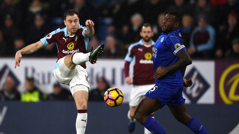 BURNLEY, ENGLAND - JANUARY 31: Ashley Barnes of Burnley and Wes Morgan of Leicester City compete for the ball during the Premier League match between Burnl